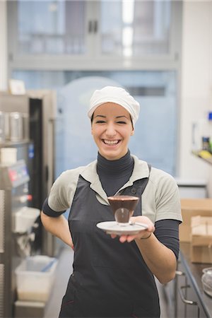 restaurant happy people apron - Barista serving hot chocolate at cafe Stock Photo - Premium Royalty-Free, Code: 649-08084575