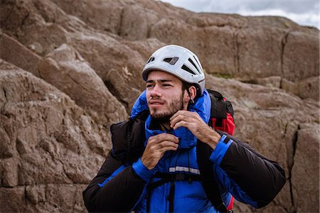 simsearch:649-08084705,k - Young male climber on rock fastening helmet, The Lake District, Cumbria, UK Stockbilder - Premium RF Lizenzfrei, Bildnummer: 649-08084714