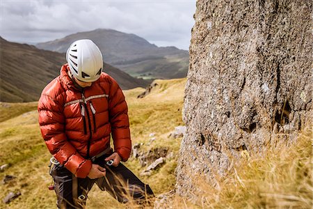 simsearch:649-08084705,k - Young male climber fastening rope, The Lake District, Cumbria, UK Stockbilder - Premium RF Lizenzfrei, Bildnummer: 649-08084712