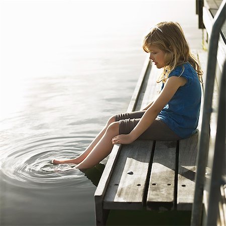dock on a lake summer feet - Girl dipping feet in lake Stock Photo - Premium Royalty-Free, Code: 649-08084780