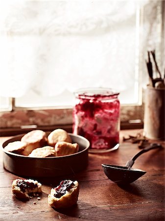 Rustic windowsill with rosella jam and puftaloons (fried scones) Stock Photo - Premium Royalty-Free, Code: 649-08085212