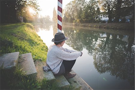 polish ethnicity (female) - Young woman sitting on steps by river, Dolo, Venice, Italy Stock Photo - Premium Royalty-Free, Code: 649-08085372