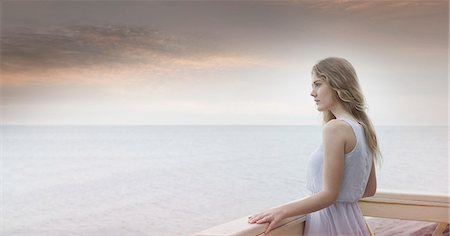 simsearch:649-07709901,k - Young woman gazing out to sea from balcony, Miami Beach, Florida, USA Stock Photo - Premium Royalty-Free, Code: 649-08085441