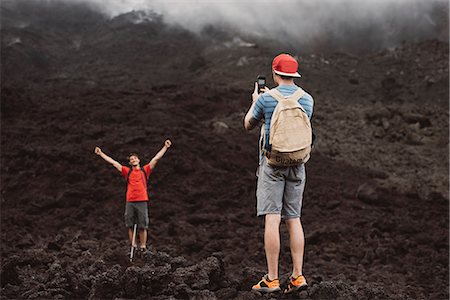 Young man photographing friend at Pacaya volcano, Antigua, Guatemala Stock Photo - Premium Royalty-Free, Code: 649-08085502