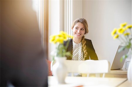 Young woman in cafe, using laptop Stock Photo - Premium Royalty-Free, Code: 649-08085581