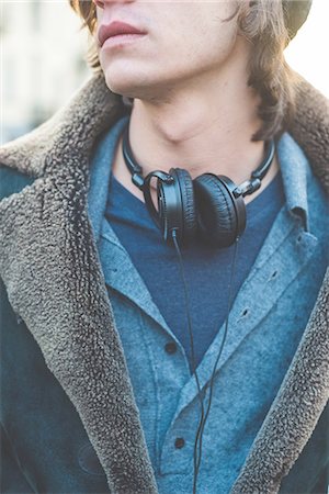 simsearch:649-08125262,k - Man with headphones hung around neck Photographie de stock - Premium Libres de Droits, Code: 649-08085902