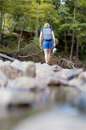 simsearch:6116-08915116,k - Hiker walking among stones in shallow stream, Waima Forest, North Island, NZ Foto de stock - Sin royalties Premium, Código: 649-08086236
