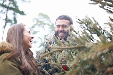 simsearch:649-08086087,k - Young couple collecting Christmas tree from forest Photographie de stock - Premium Libres de Droits, Code: 649-08086302