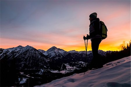 simsearch:614-08066013,k - Young female hiker looking out from mountainside at dusk, Reutte, Tyrol, Austria Stock Photo - Premium Royalty-Free, Code: 649-08086388