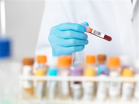 shallow depth of field - Close up of scientists hands selecting a blood sample for medical testing Stock Photo - Premium Royalty-Free, Code: 649-08086465