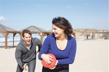 simsearch:649-08086376,k - Young couple running with ball on beach, Tel Aviv, Israel Stock Photo - Premium Royalty-Free, Code: 649-08086466