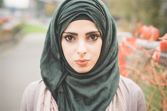 Close up portrait of young woman wearing hijab Stock Photo - Premium Royalty-Free, Image code: 649-08086479