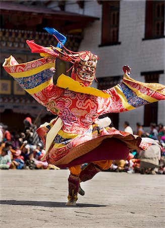festival (street parade and revelry) - Masked performer dancing at festival, Punakha, Bhutan Stock Photo - Premium Royalty-Free, Code: 649-08086775