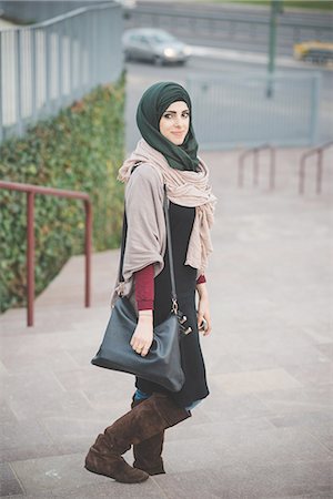 Portrait of young woman wearing hijab on stairway Stock Photo - Premium Royalty-Free, Code: 649-08086867