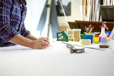 framing (activity) - Mid adult man writing measurement on workbench in picture framers workshop Stock Photo - Premium Royalty-Free, Code: 649-08086958