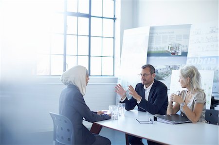 promotion (travail) - Business team discussing presentation ideas in conference room Photographie de stock - Premium Libres de Droits, Code: 649-08117895