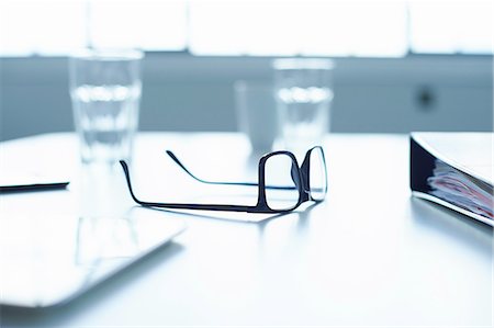 simsearch:6122-07698480,k - Spectacles and digital tablet on conference table Stock Photo - Premium Royalty-Free, Code: 649-08117908