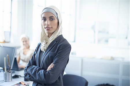 simsearch:649-08117899,k - Portrait of young businesswoman wearing hijab in office Stock Photo - Premium Royalty-Free, Code: 649-08117900