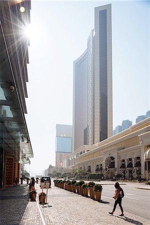 Young female tourist strolling on city street, Macau, Hong Kong, China Stock Photo - Premium Royalty-Free, Code: 649-08117926