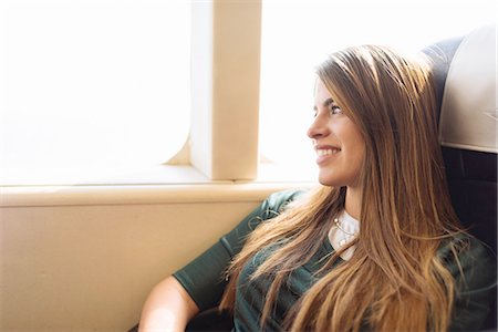 Young female tourist gazing out of train carriage window, Macau, Hong Kong, China Stock Photo - Premium Royalty-Free, Code: 649-08117930