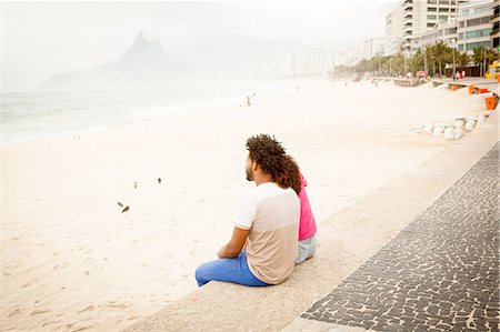 simsearch:649-08125388,k - Couple sitting looking out from Ipanema beach, Rio De Janeiro, Brazil Stock Photo - Premium Royalty-Free, Code: 649-08118044