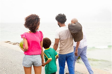 simsearch:649-08125413,k - Rear view of family of four strolling along Ipanema beach, Rio De Janeiro, Brazil Stock Photo - Premium Royalty-Free, Code: 649-08118043