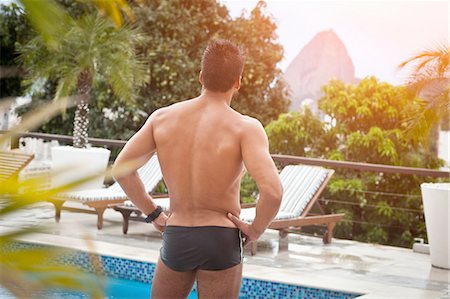 simsearch:649-07804544,k - Man by poolside, Sugarloaf Mountain in background, RIo, Brazil Stock Photo - Premium Royalty-Free, Code: 649-08118111