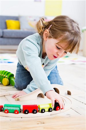 Girl playing with toy cars at home Stock Photo - Premium Royalty-Free, Code: 649-08118130