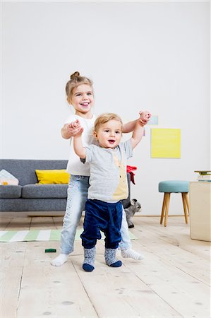 simsearch:649-09269303,k - Brother and sister playing at home Stock Photo - Premium Royalty-Free, Code: 649-08118145