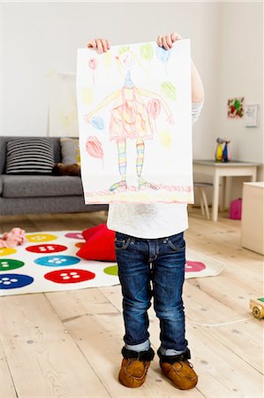 simsearch:649-08118186,k - Toddler holding up painting at home Photographie de stock - Premium Libres de Droits, Code: 649-08118178