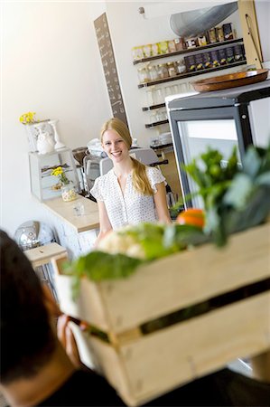 service store communication - Man delivering crate of vegetables to shopkeeper Stock Photo - Premium Royalty-Free, Code: 649-08118327