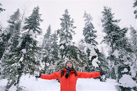 finland winter - Young woman celebrating in snow covered forest, Posio, Lapland, Finland Photographie de stock - Premium Libres de Droits, Code: 649-08118776