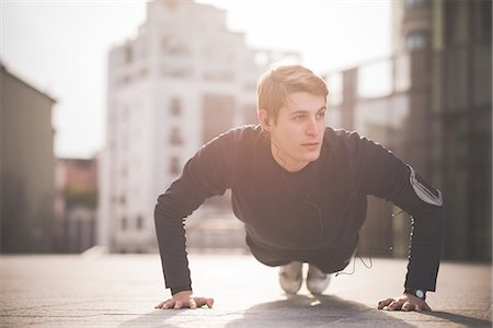 physical fitness (activity) - Young man doing press ups in city square Stock Photo - Premium Royalty-Free, Code: 649-08118838