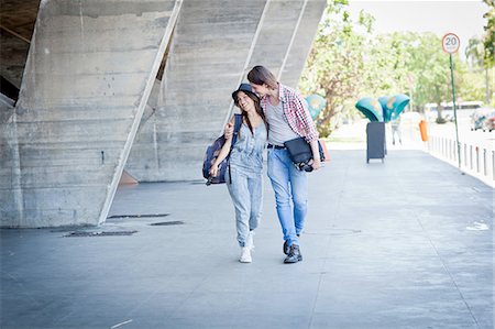 Young couple walking by building Stock Photo - Premium Royalty-Free, Code: 649-08118934