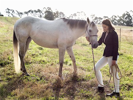 simsearch:649-08900813,k - Teenage girl leading grey horse in field Stock Photo - Premium Royalty-Free, Code: 649-08124919