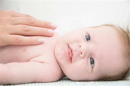 safe hand - Baby on bed Stock Photo - Premium Royalty-Free, Code: 649-08125140