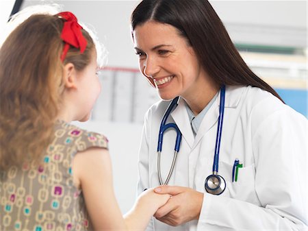 stethoscope two girls - Doctor bonding with young girl during consultation Stock Photo - Premium Royalty-Free, Code: 649-08125154