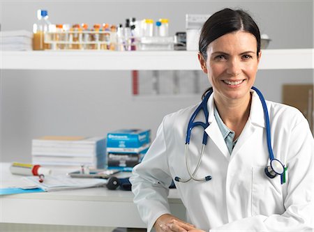 portrait doctor patient hospital - Doctor at desk awaiting patient Stock Photo - Premium Royalty-Free, Code: 649-08125169