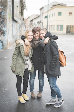 Three sisters posing on street Stock Photo - Premium Royalty-Free, Code: 649-08125220