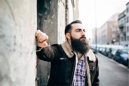 simsearch:649-08125291,k - Young bearded man by concrete wall Stock Photo - Premium Royalty-Free, Code: 649-08125307