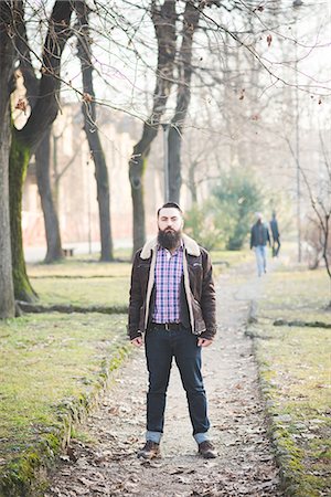 Young bearded man in park Stock Photo - Premium Royalty-Free, Code: 649-08125316