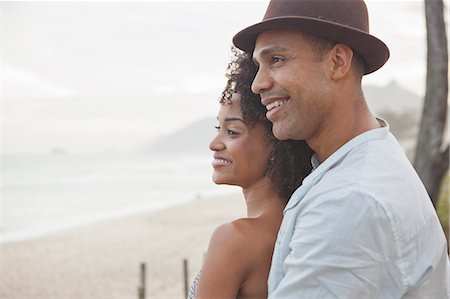 simsearch:649-08125388,k - Smiling couple looking out over beach, Rio De Janeiro, Brazil Stock Photo - Premium Royalty-Free, Code: 649-08125388