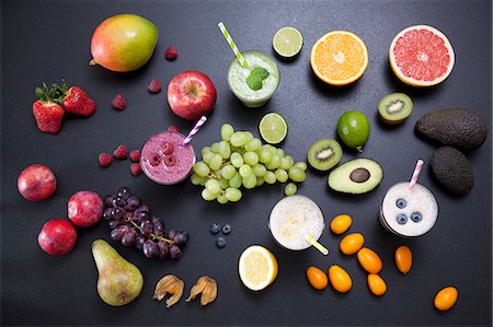 simsearch:614-09210324,k - Overhead still life of fresh fruit and smoothies Stock Photo - Premium Royalty-Free, Code: 649-08125432