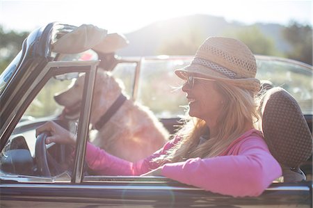 roadtrip convertible - Mature woman and dog, in convertible car Stock Photo - Premium Royalty-Free, Code: 649-08125545