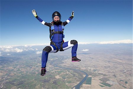 skydiving in a business suit - Freeflying skydiver in blue sky Stock Photo - Premium Royalty-Free, Code: 649-08125855