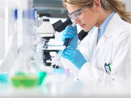 safety glasses - Female scientist pipetting sample into a vial for analytical testing in a laboratory Stock Photo - Premium Royalty-Free, Code: 649-08125913