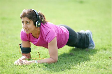 Mature woman doing plank exercises in park Stock Photo - Premium Royalty-Free, Code: 649-08144361