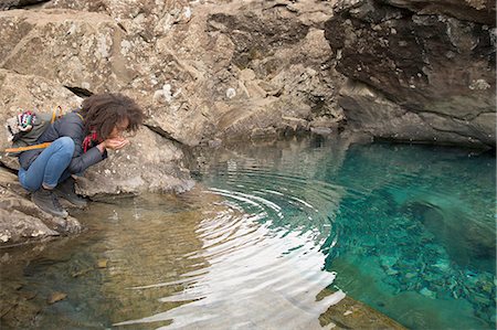 simsearch:649-08144531,k - Woman drinking water from cupped hands, Fairy Pools, Isle of Skye, Hebrides, Scotland Stock Photo - Premium Royalty-Free, Code: 649-08144530