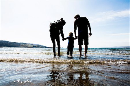 parent holding hands child silhouette - Family holding hands on beach, Loch Eishort, Isle of Skye, Hebrides, Scotland Stock Photo - Premium Royalty-Free, Code: 649-08144627