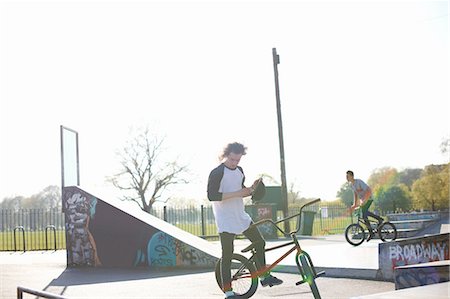 simsearch:649-07648152,k - Two young men on bmx bikes at skatepark Stock Photo - Premium Royalty-Free, Code: 649-08144682